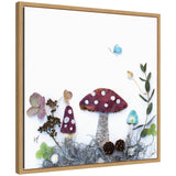 Framed artwork depicting three mushrooms with red and blue caps spotted white, surrounded by greenery, small pinecones, and a blue butterfly on a white background.