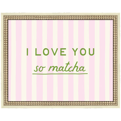 Framed art print titled 'I Love You So Matcha' with pink and green stripes in a distressed white frame displayed on wall