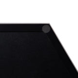 Close-up of a corner of a black hexagonal decorative tray with a matte finish and a small circular rubber grip on the inner edge