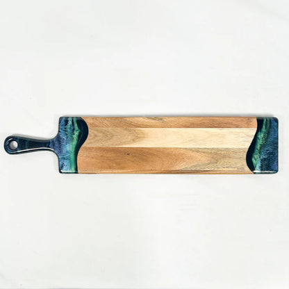 Wooden baguette resin serving with a blue and green resin handle on a white background