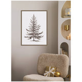 Framed vintage-style black and white fir tree illustration on a beige wall above a textured cream chair with a gold wrapped gift and gold ornament.