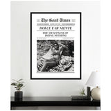 Framed black-and-white wall art designed like a vintage newspaper cover titled 'The Good Times' featuring a woman lounging on a checkered blanket with the headline 'Dolce Far Niente: The Sweetness of Doing Nothing'.