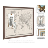 Framed pinboard with vintage black and white world map on linen fabric, featuring a dark wood frame and two pinned black-and-white photos.