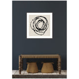 Abstract framed artwork with overlapping black circular lines on beige background, hung on dark gray wall above wooden bench with spindle legs and two woven baskets below.