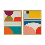 Two framed canvases featuring mid century modern abstract patterns with geometric shapes in mustard yellow, teal, orange, red, navy blue, and magenta on a cream background.