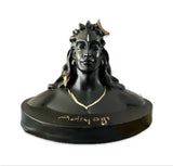 Adiyogi Statue displayed on car dashboard and pooja settings