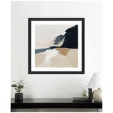 Abstract coastal landscape painting with broad brushstrokes in beige, white, dark blue, and gray tones framed in black on a white wall above a black table with plants, books, and a lamp.