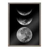Framed black glass print with three detailed gray moon phases—crescent, half, and full—arranged vertically on a black background