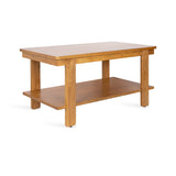 Rectangular wooden coffee table with a smooth top surface and a lower shelf supported by four straight legs, shown in a light brown finish against white background.