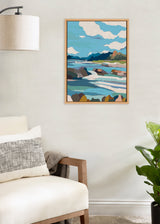 Framed canvas wall art depicting abstract landscape with blue sky, white clouds, mountains, water, and rocks in shades of blue, green, beige, and brown.