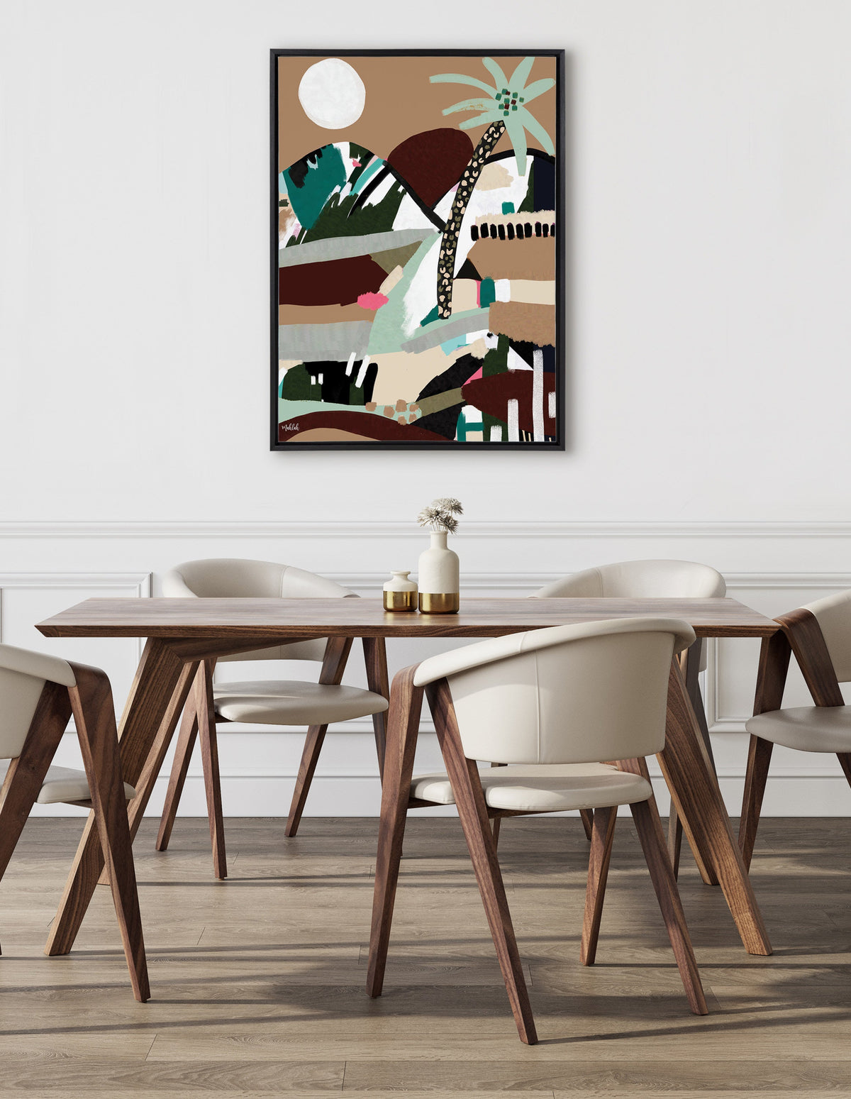 Abstract framed canvas with earthy tones, featuring a stylized palm tree and geometric shapes in green, brown, and beige, hung above a modern dining table with wooden legs and white chairs.