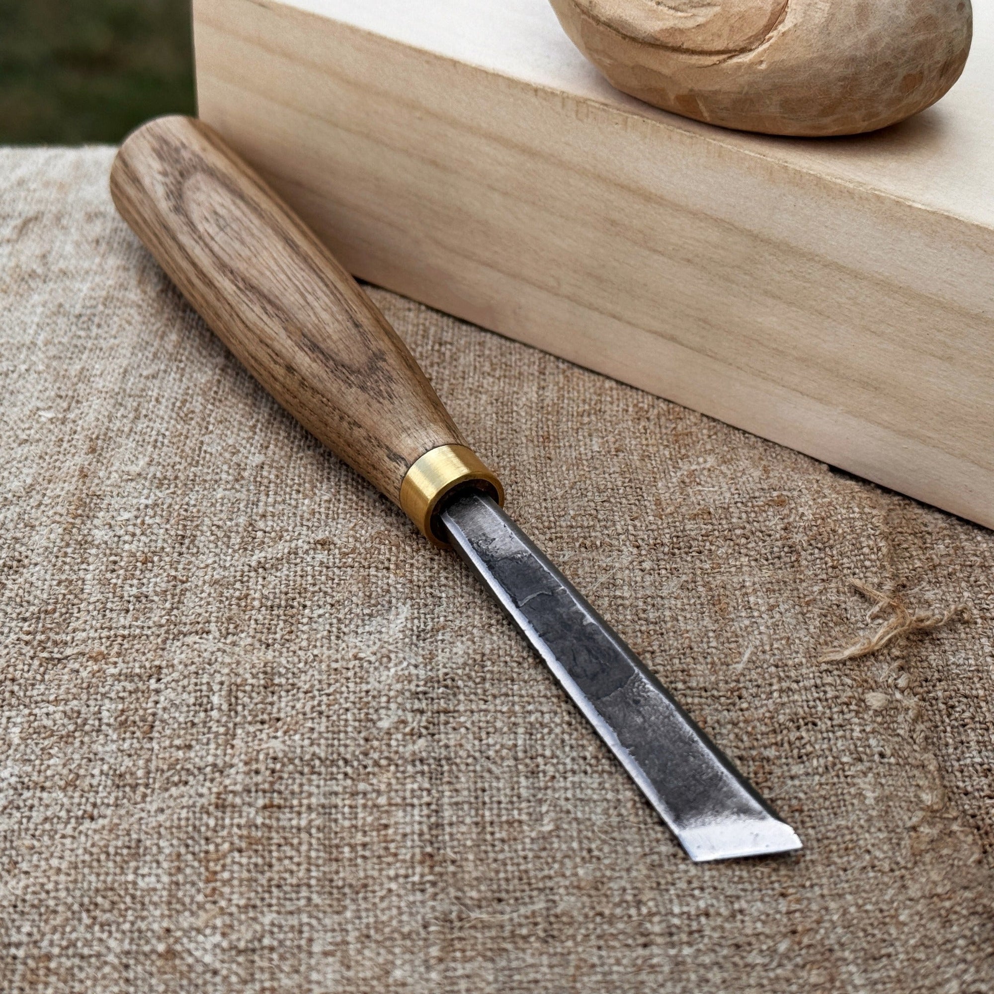 Angled bevel carving chisel with 10 mm blade and wooden handle by Sharky Forged Steel Tools