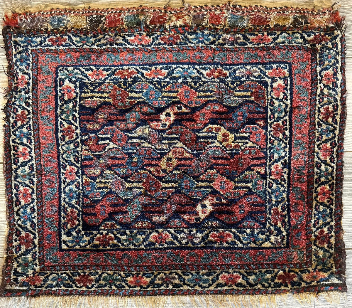 Antique small Kurdish square decorative hanging rug 22x24 featuring natural dyes and intricate patterns