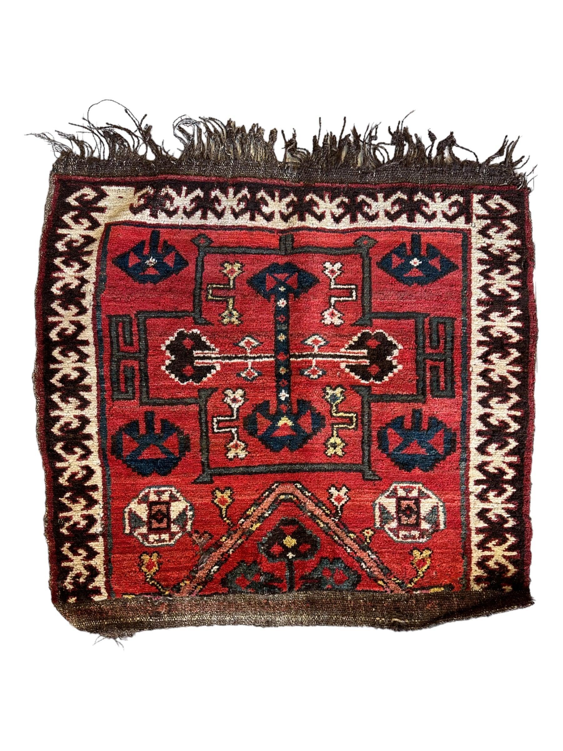 Antique Tribal Bagface Persian rug in natural wool, hand-knotted, showing vintage worn detail