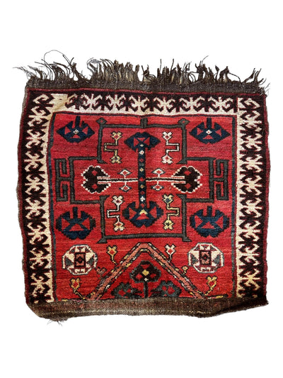 Antique Tribal Bagface Persian rug in natural wool, hand-knotted, showing vintage worn detail