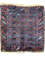 Antique Tribal Baluch Bag Face rug measuring 22 by 24 inches with natural wool pile and tribal design