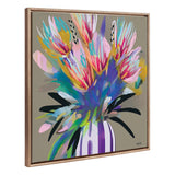 Colorful abstract bouquet with bright pink, yellow, and purple petals and black accents in a white and purple striped vase on taupe background.