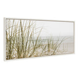 Framed canvas showing tall, green beach grass with wispy blades on sandy shore under a pale, foggy sky and calm sea in muted pastels.