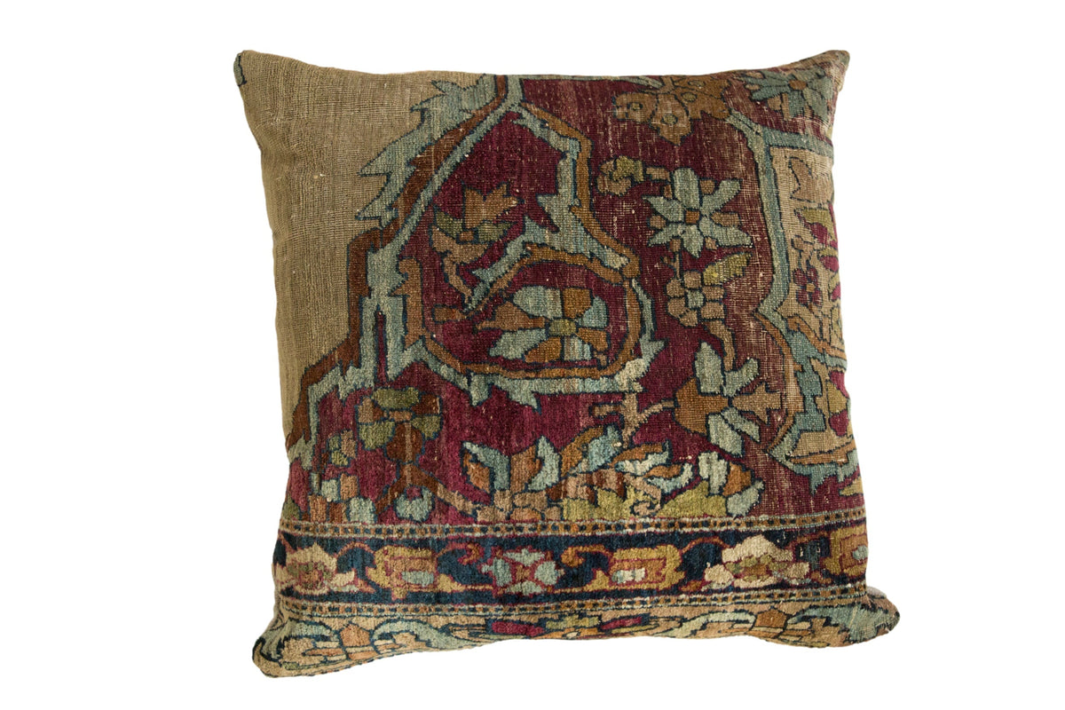 Antique Kerman Rug Fragment Pillow showing rich colors of red, blue, orange, and green with textured wool surface