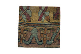 Decorative cork board featuring antique Kerman rug fragment with silk-like wool pile and muted earth tones
