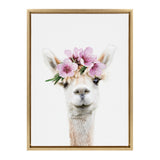 Portrait of a white alpaca centered on a white background wearing a pink flower crown with green leaves, framed in light wood.