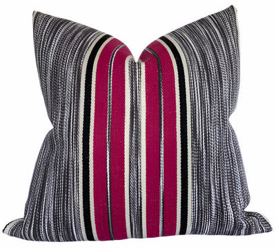 Audley Stripe Pillow Cover in Berry showing red and muted tones of stripes on chair