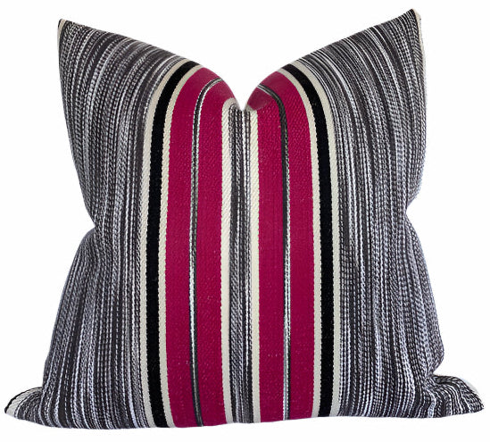 Audley Stripe Pillow Cover in Berry showing red and muted tones of stripes on chair