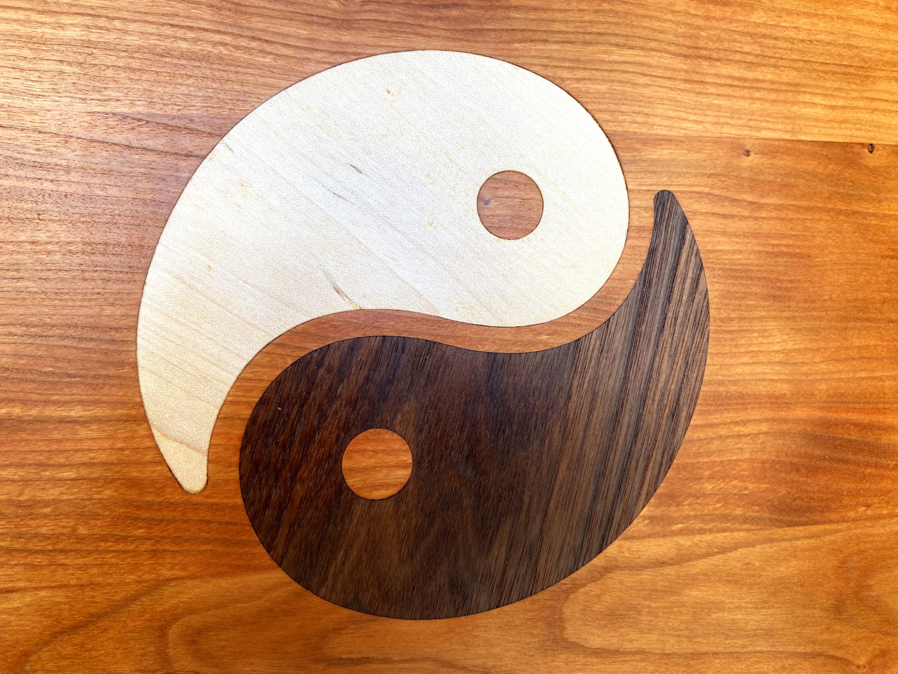 Cherry wood charcuterie board with Yin Yang inlay of Maple and Peruvian Walnut