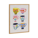 Framed artwork featuring six colorful coffee mugs in two columns, each decorated with unique floral and leaf patterns in bright yellows, pinks, reds, greens, and blues on a white background.