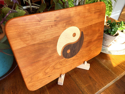 Cherry wood charcuterie board with Yin Yang inlay of Maple and Peruvian Walnut
