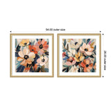 Two framed floral prints side by side, each featuring an abstract bouquet with peach, cream, and orange flowers accented by blue and green leaves in soft brushstrokes.