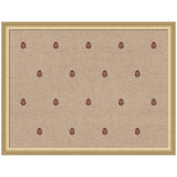 Beige textured fabric with evenly spaced small red botanical block print motifs, framed in a simple light wood frame.