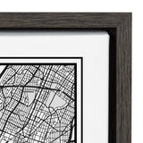 Close-up of a black wood frame surrounding a white canvas printed with a monochrome black and gray street map section showing intersecting city streets and blocks.