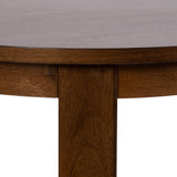 Close-up of the edge and leg of a round wood side table with a smooth, dark brown finish and visible wood grain texture.