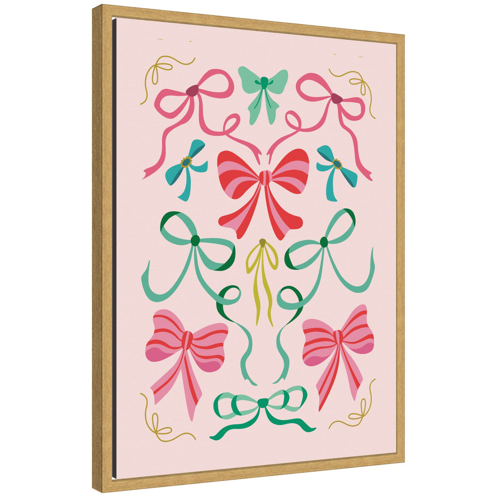 Sylvie framed canvas featuring decorative Christmas bows in shades of pink, green, and teal on a light pink background
