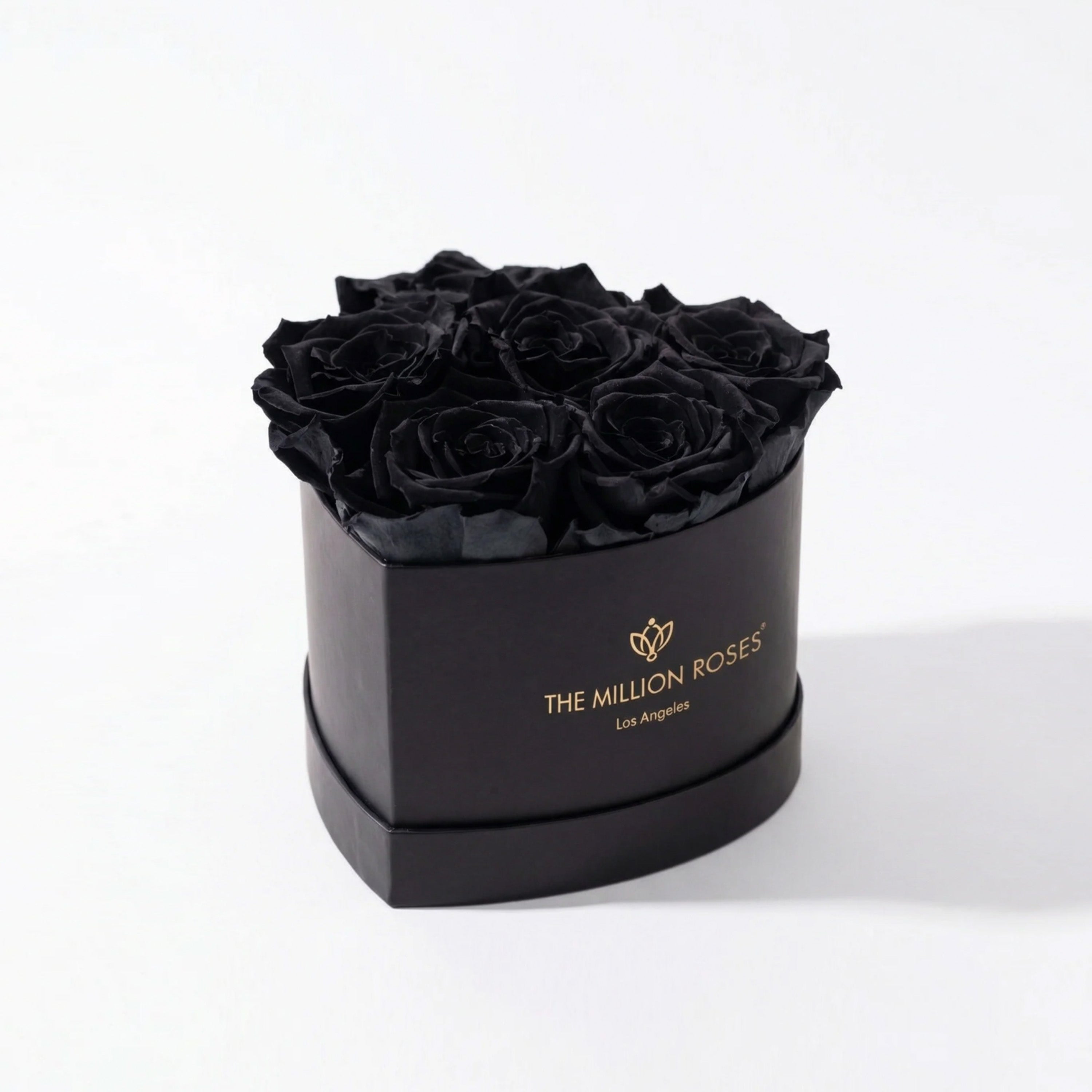 Baby Heart Black Box with six black roses arranged in a heart shape inside a sleek black box.