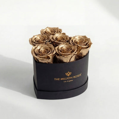 Baby Heart Black Box containing six gold roses arranged in a heart shape