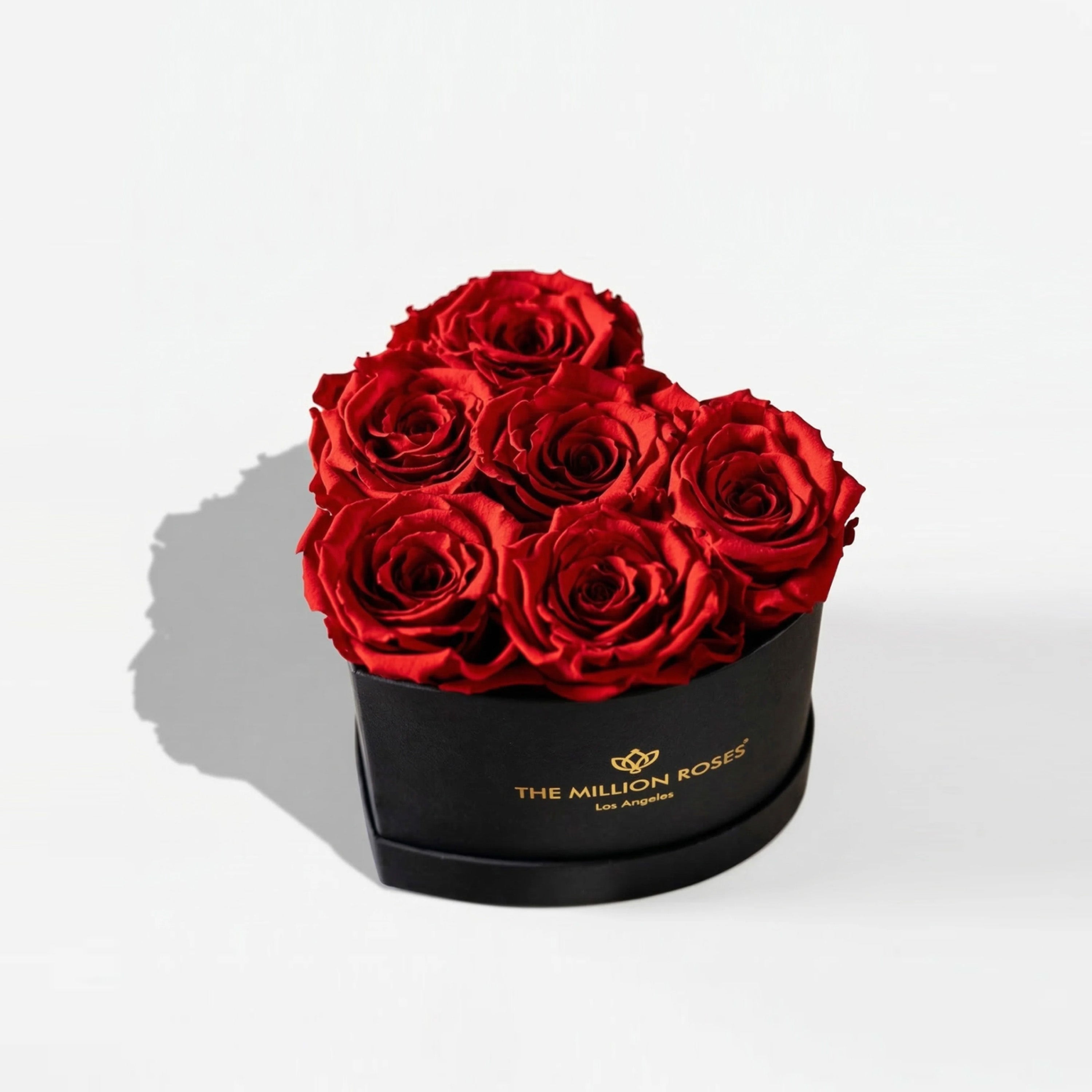 Baby Heart Black Box with 6 red roses arranged in a heart shape inside a black square box