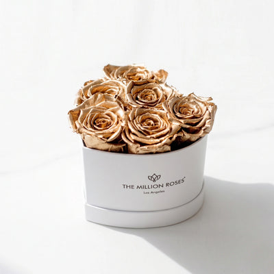 Baby Heart White Box containing 6 gold roses arranged in a heart shape