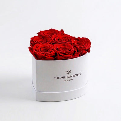 Six vivid red roses shaped into a heart in a white box from The Million Roses