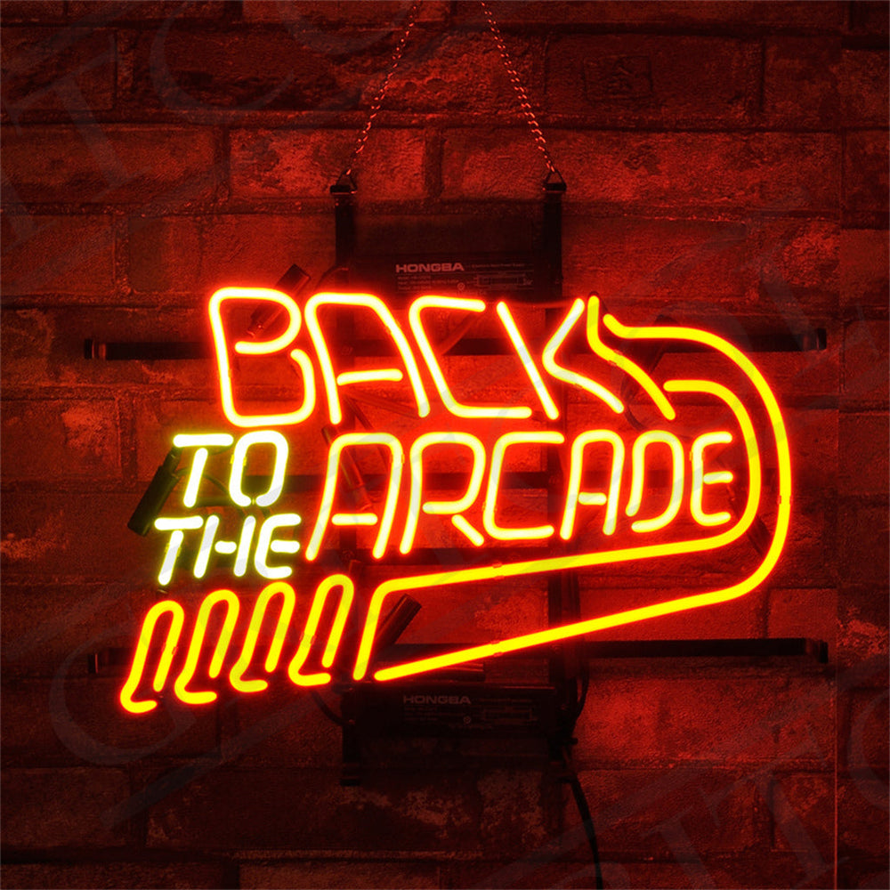 Back to The Arcade Neon Signs glowing against a dark wall, featuring bright neon colors on a metal grid backing.