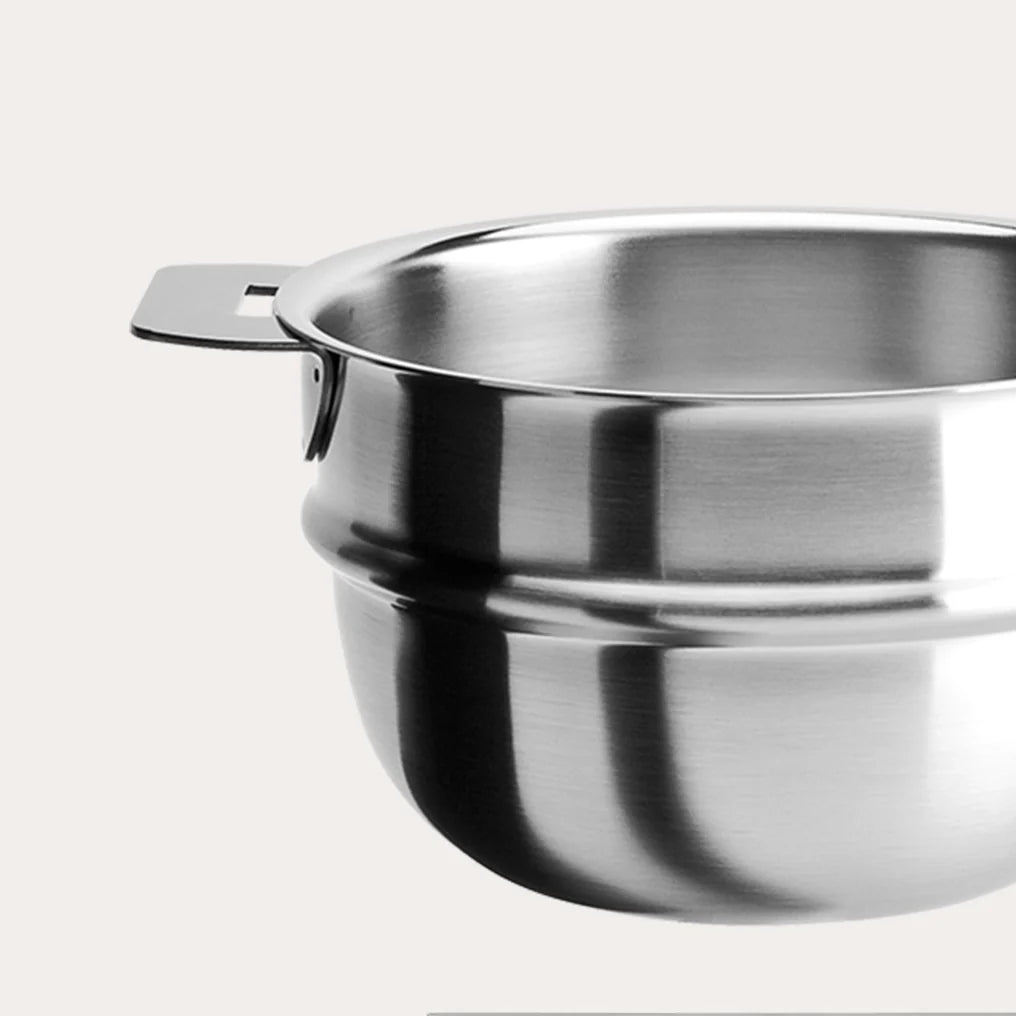 Shiny stainless steel bain-marie insert with a wide rim and a single flat handle against a plain white background, showing a close-up view of its smooth interior and reflective surface.