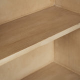 Close-up detail of a beige wood shelf within a matching wooden cabinet, showing the grain texture and corner joinery.