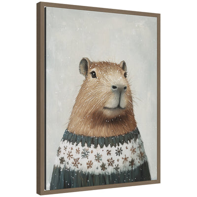 Framed canvas art of a capybara wearing a winter snowflake sweater surrounded by gentle snowfall in muted colors