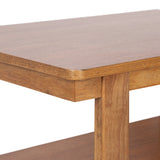 Close-up of a wooden rectangular table corner with rounded edges and a vertical leg, showing smooth natural wood grain and warm brown tones.