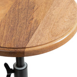 Round wooden tabletop with warm, varied brown tones and smooth, rounded edges, supported by a black adjustable metal stand with a tightening knob.