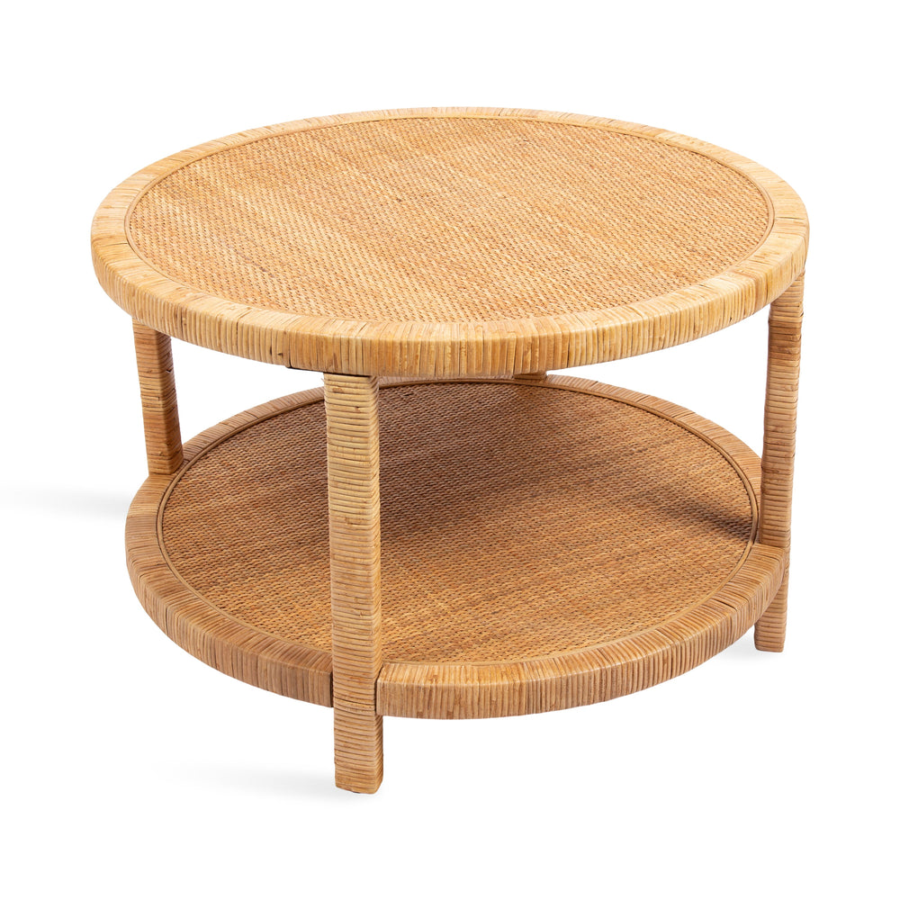 Rafina Rattan Round Coffee Table with natural rattan legs and round tiered tabletop in a bright living room setting