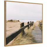 Framed canvas print of a boardwalk through coastal beach grass leading to the ocean