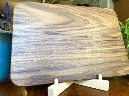 Walnut charcuterie board with Cherry and Maple decorative banding by Fitzgerald Custom Woodcraft