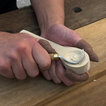 Beginner DIY Spoon Carving Kit with hand-forged knives, linden wood blanks, and carving tools laid out